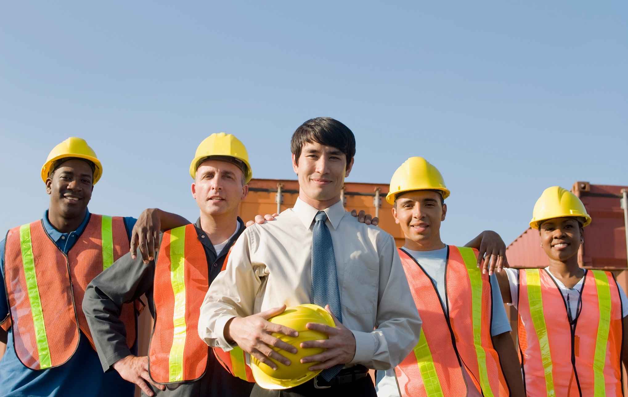 Safety training team wearing hard hats and hi-vis vests
